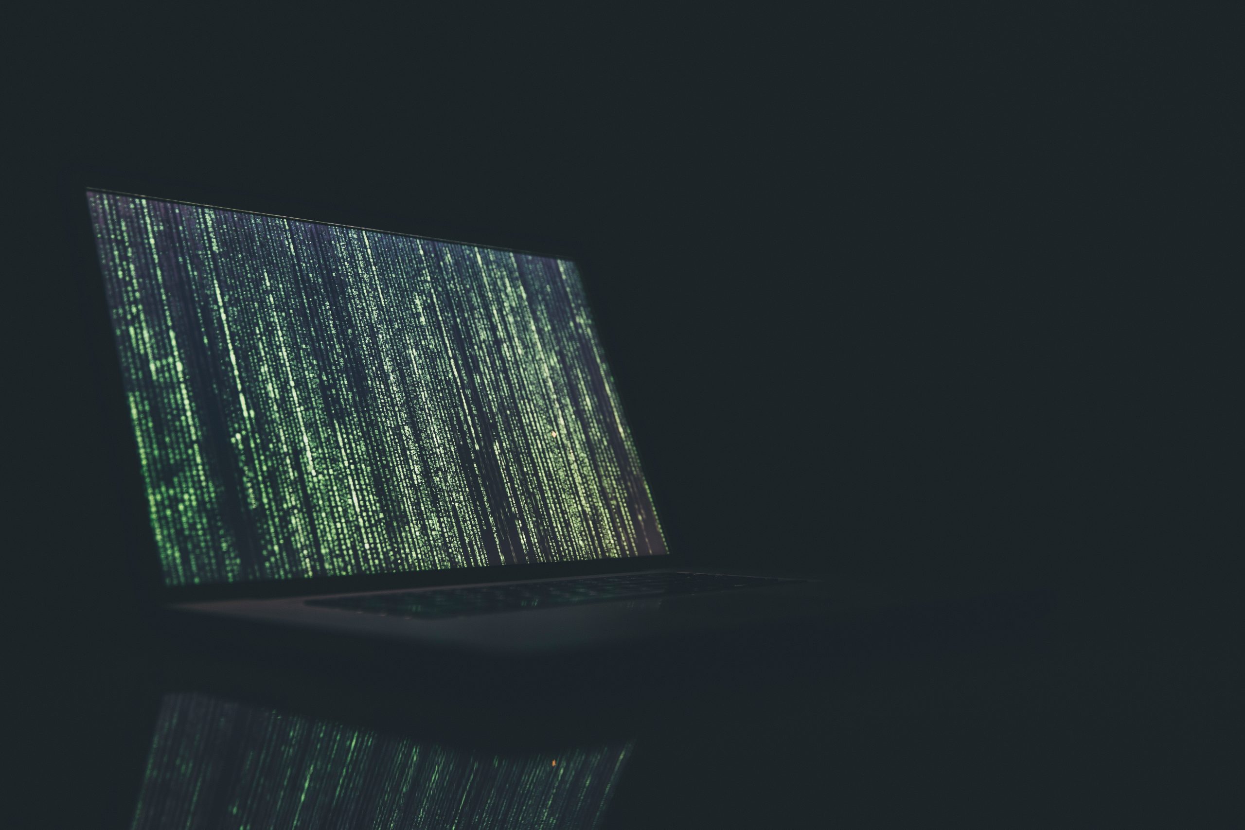 green text on dark screen cybersecurity